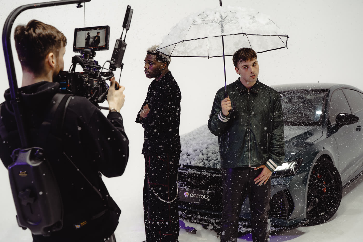 Pamir Shakir directing a car campaign shoot on a snow-effect studio set
