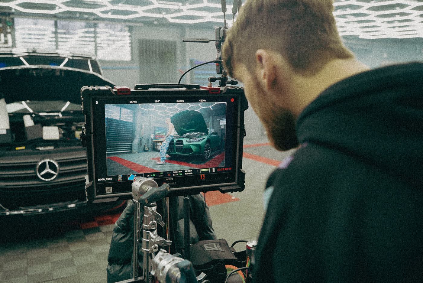 Pamir Shakir checking a frame on the video village monitor during a car commercial shoot